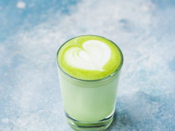 close up photo of glass of matcha drink