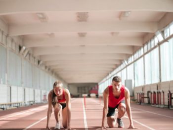 young athletes preparing for running in training hall