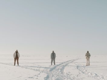 men standing on the white snow