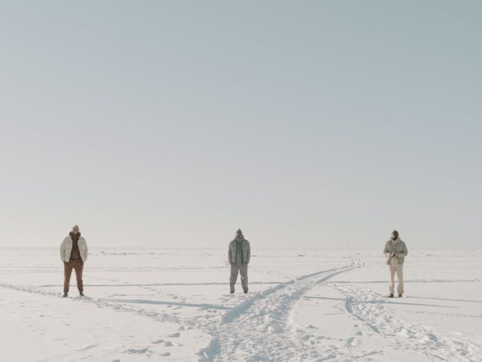 men standing on the white snow