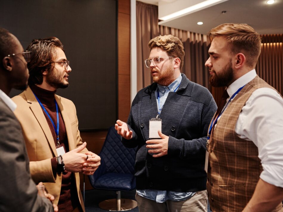 men in discussion at an event