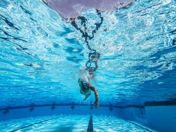 photo of an athlete swimming underwater