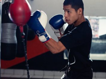 photo of a man in a black shirt training for boxing